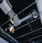 low angle shot metal black ceiling with white ventilation pipessmall